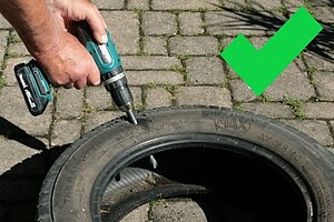 Autoreifen mit Bohrer druchlöchern